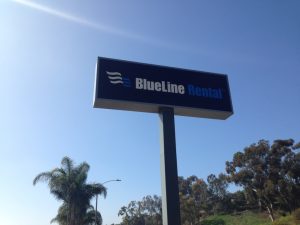 a small pylon sign for Blueline Rentals