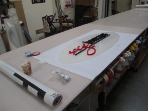 finished lobby sign on production table