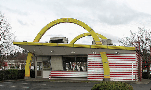 McDonalds uses the design and architecture of the building as their sign