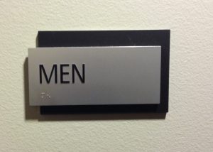 a 2 layer ADA Men's room sign