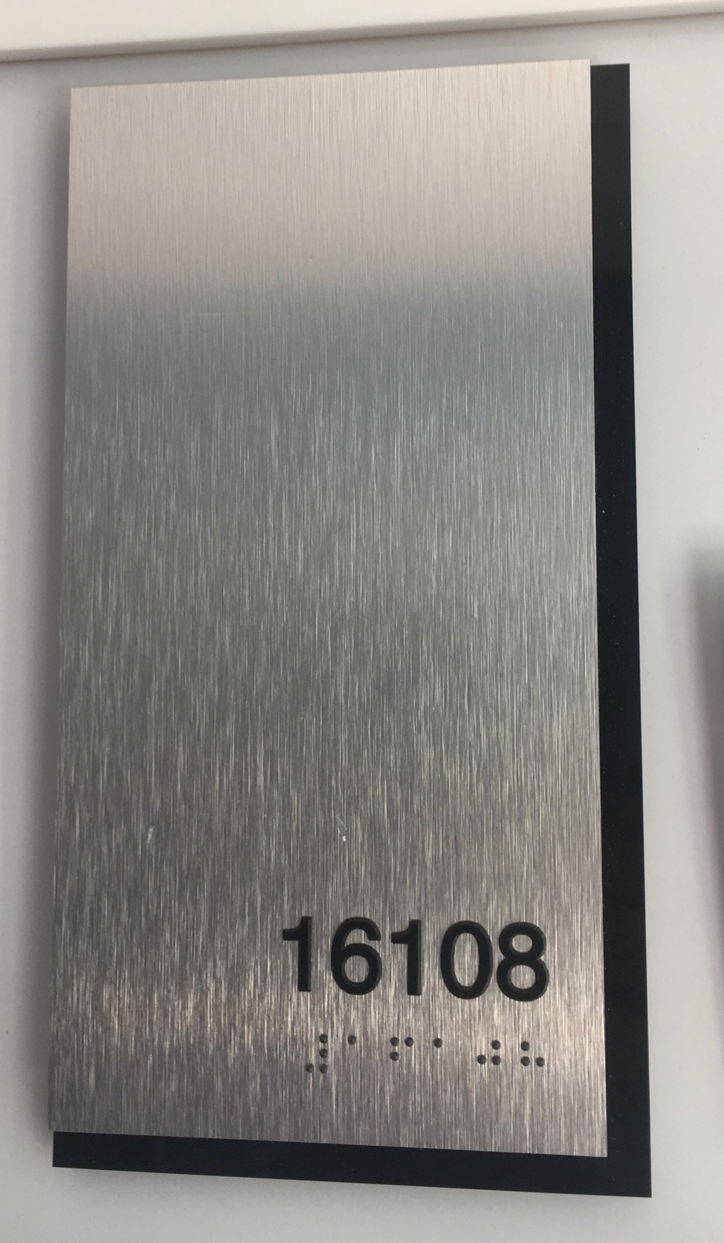 Brushed Aluminum ADA Unit ID with black acrylic backer