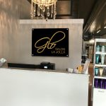 Lobby Sign on Black Acrylic and gold lettering