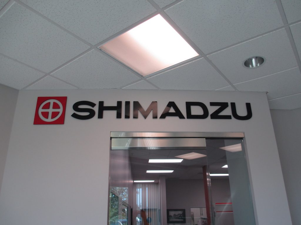 3d letters making up a Lobby Sign Shimadzu