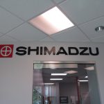 3d letters making up a Lobby Sign Shimadzu