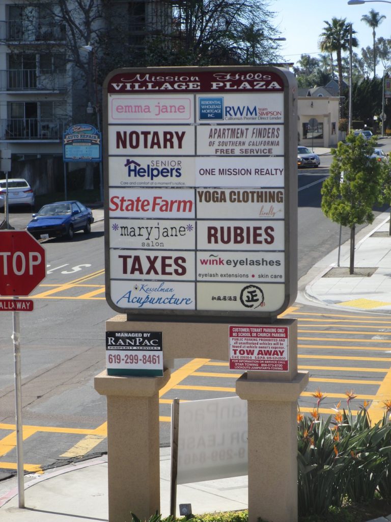 Monument Sign with mixed and non matching tenant signs