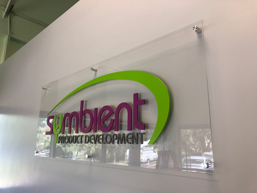 lobby sign with a clear acrylic backer and flat cut out letters