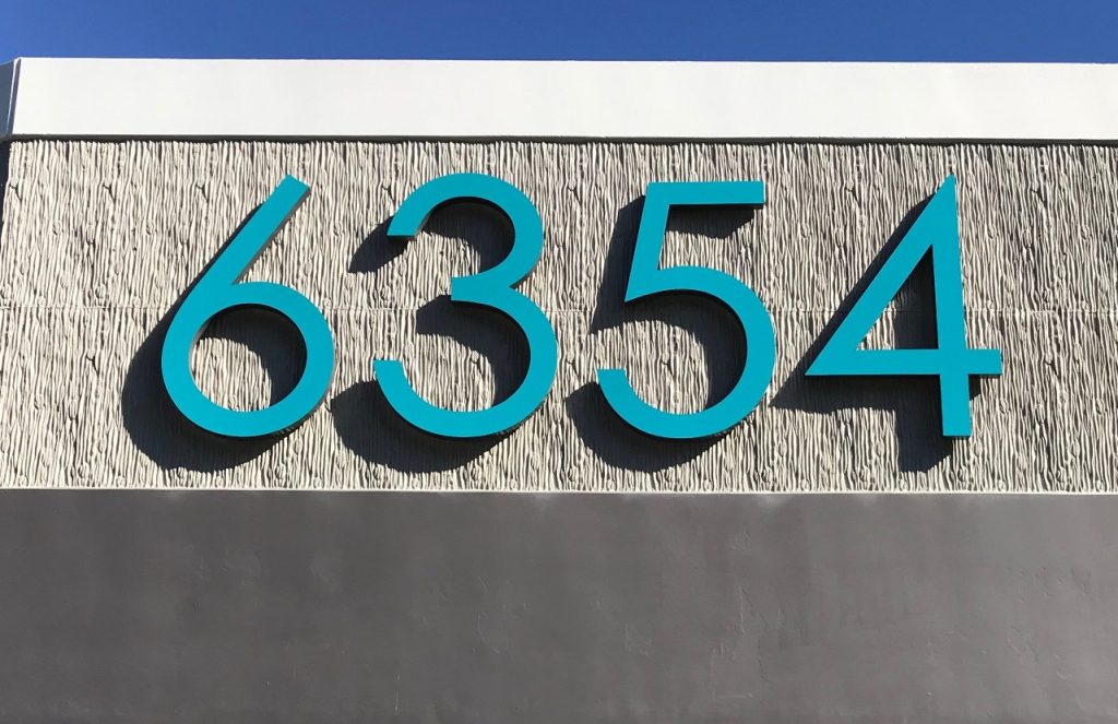 blue fabracated numbers for an address