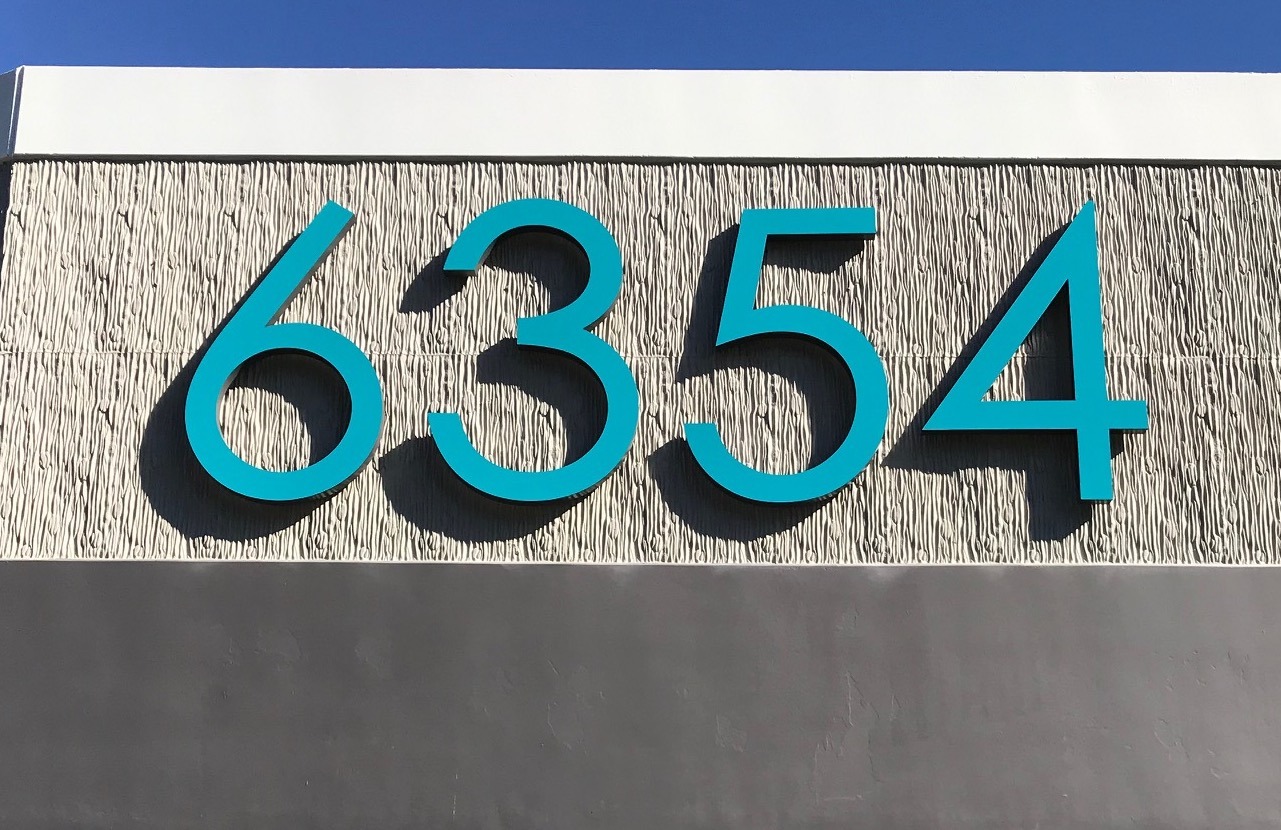 blue fabracated numbers for an address