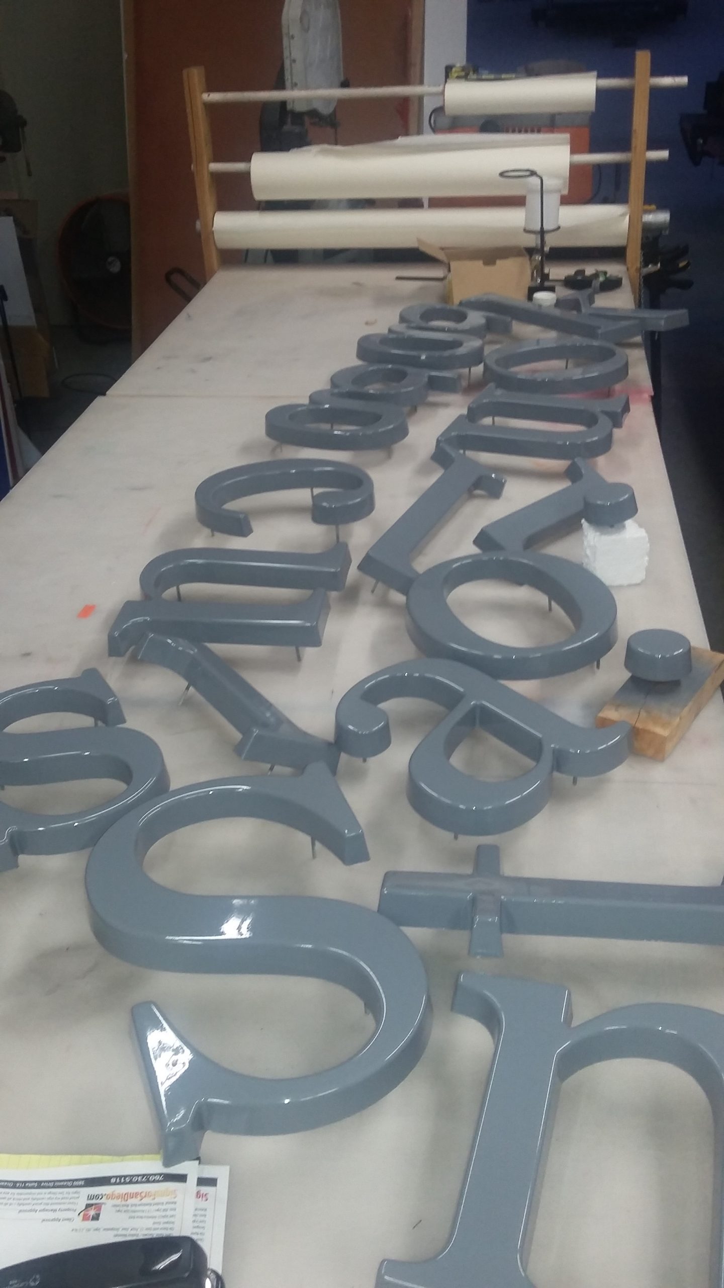 dimensional letters being painted
