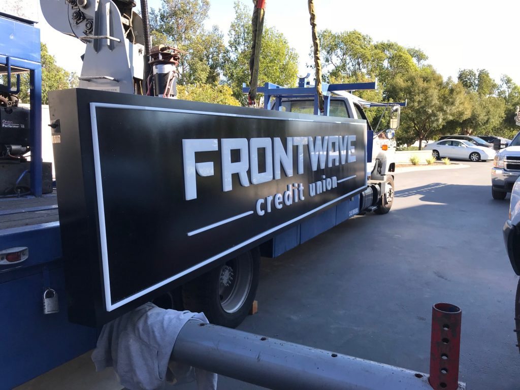 Installing a Hybrid Cabinet and Channel Letter Illuminated Sign